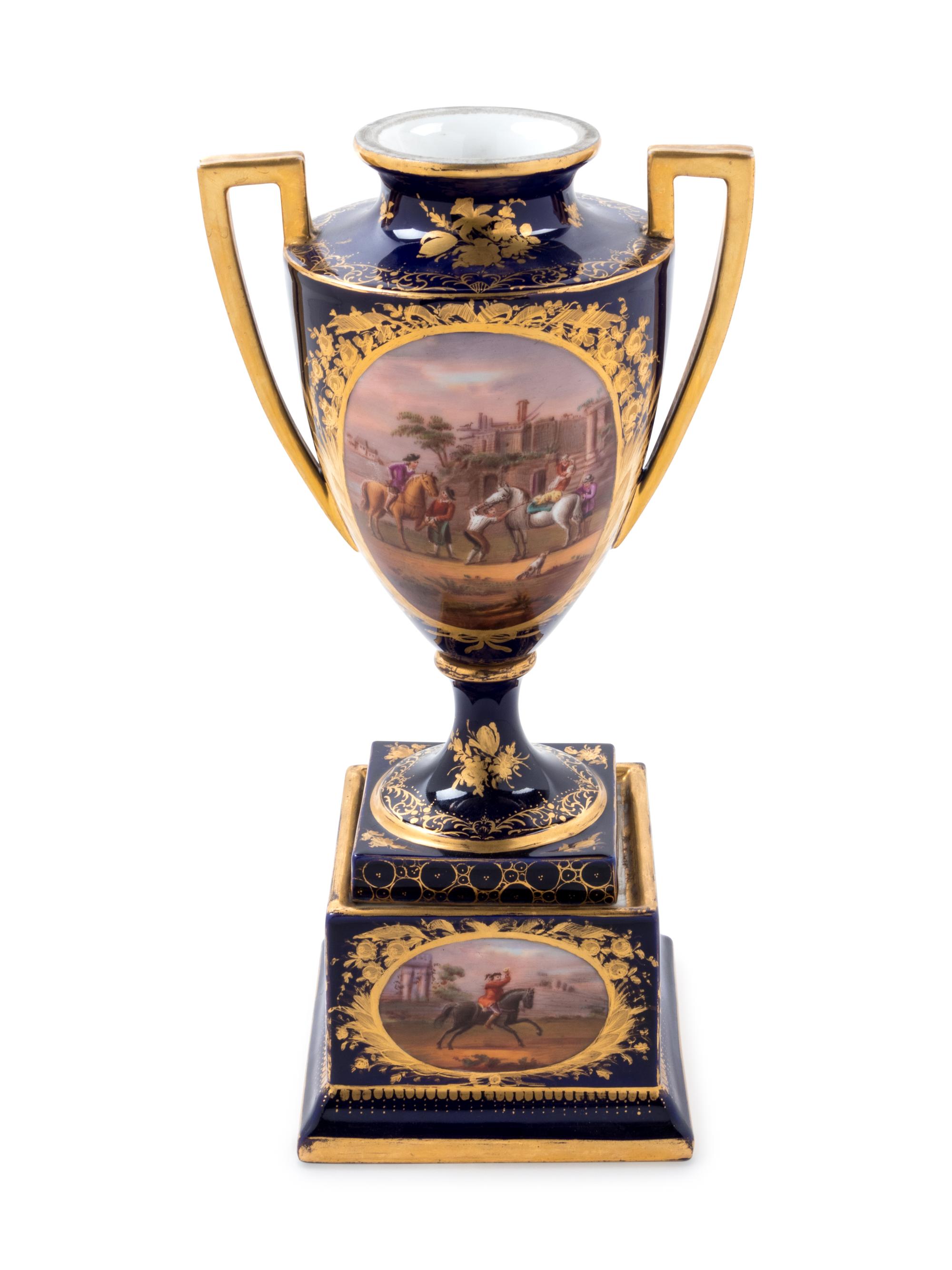 A Sèvres Style Painted and Parcel Gilt Porcelain Urn on Stand
