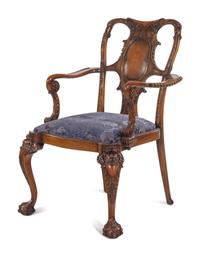An Irish George I Style Carved Walnut Armchair
