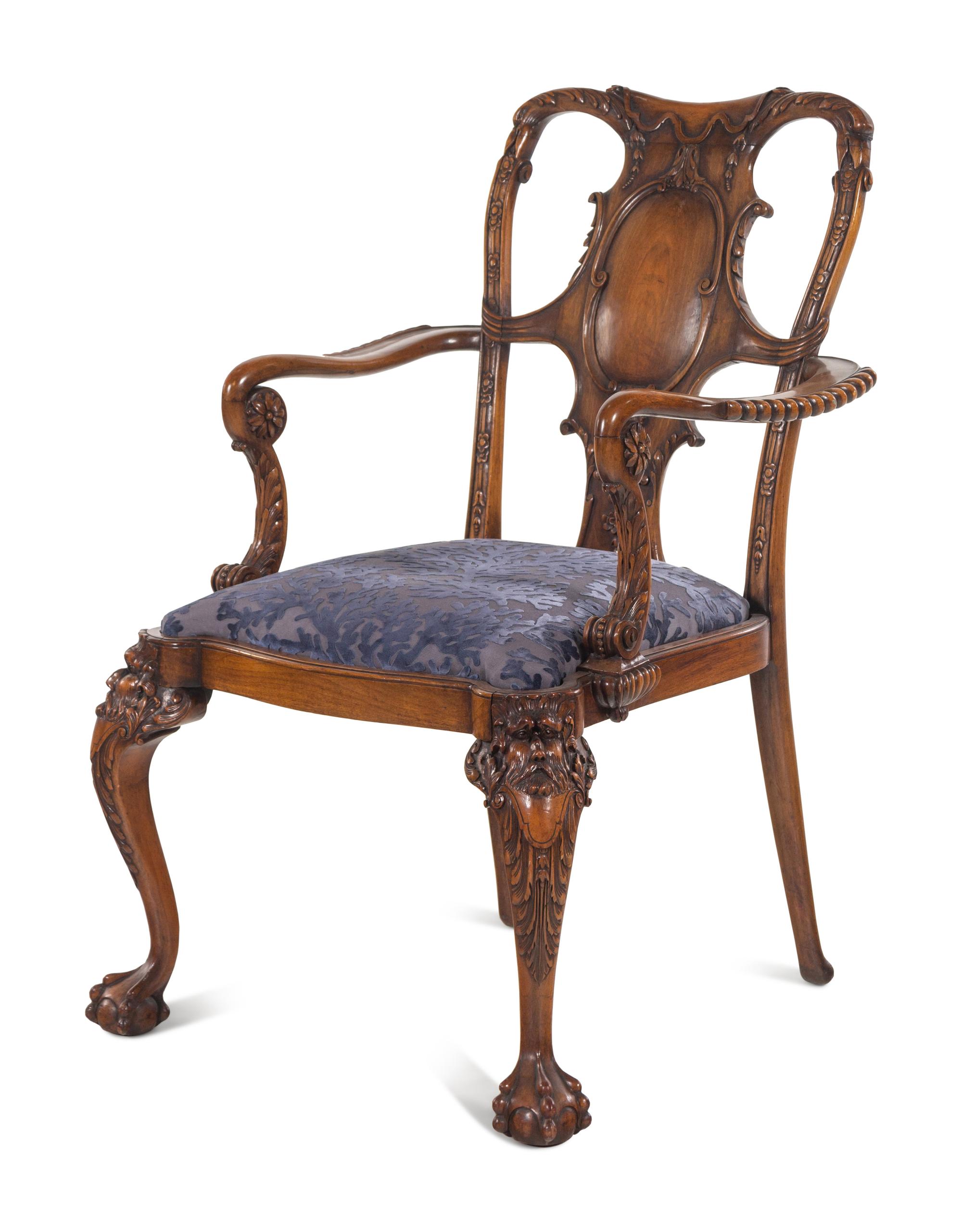 An Irish George I Style Carved Walnut Armchair