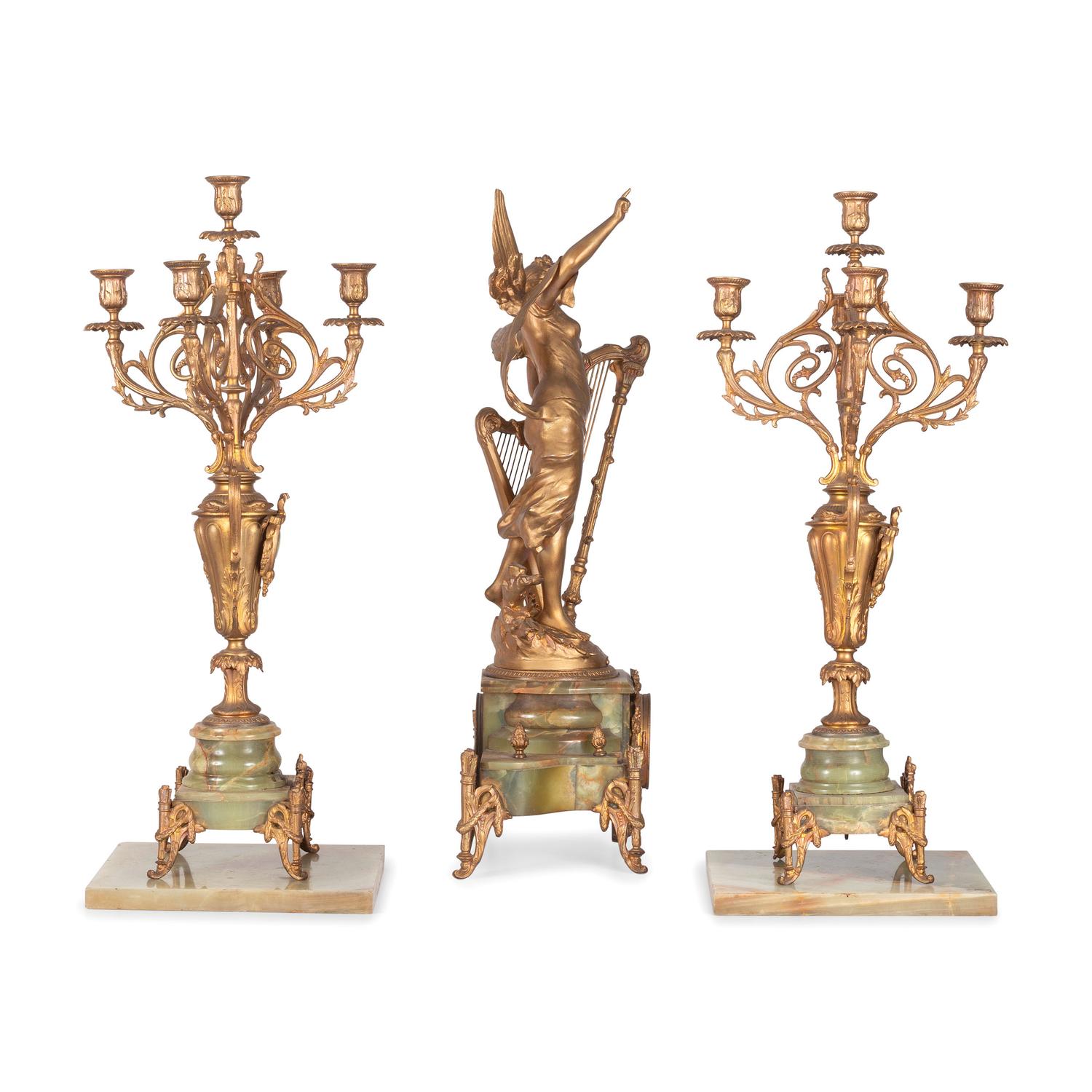 A Neoclassical Gilt Metal and Onyx Clock Garniture