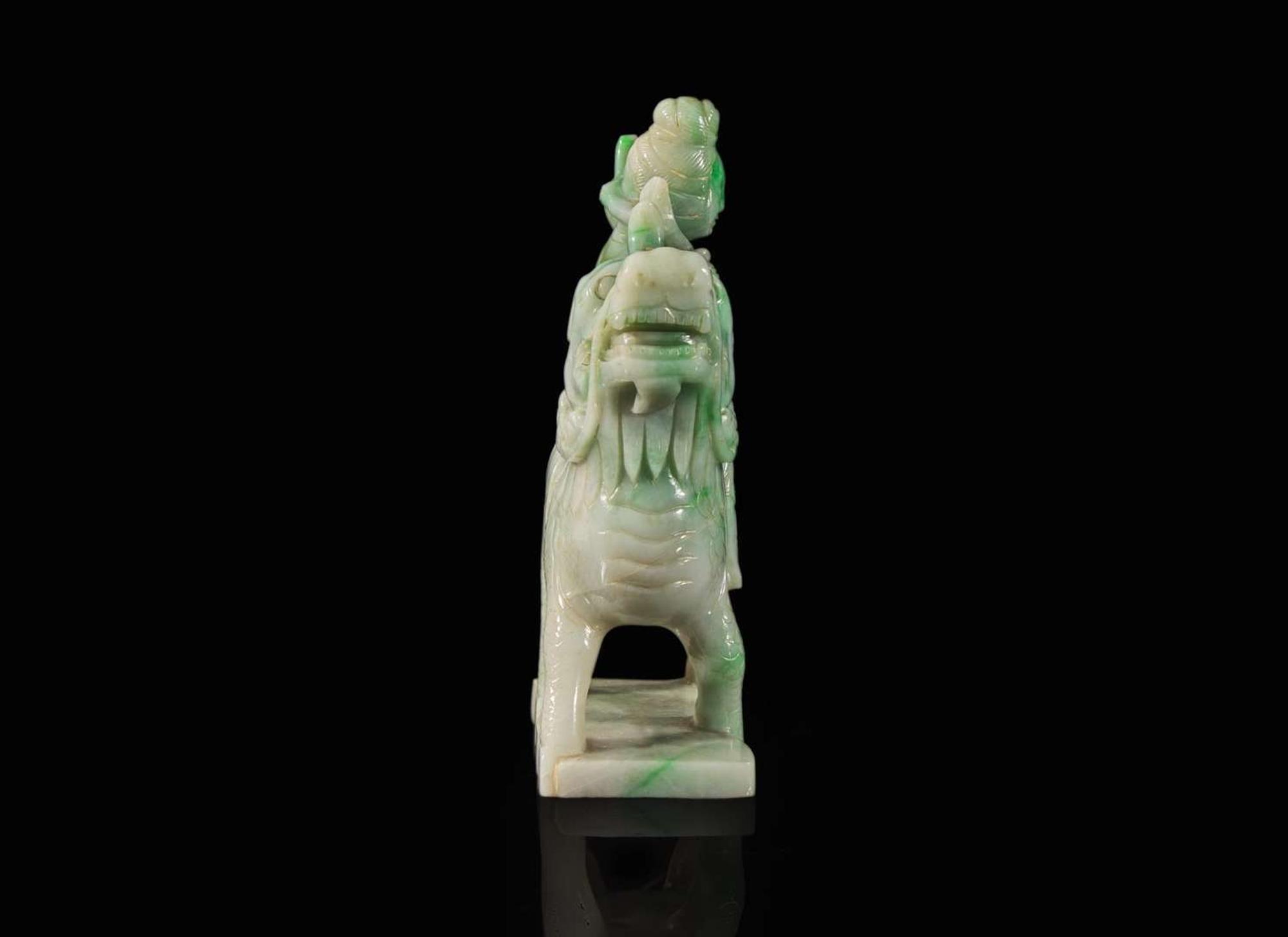 A Chinese jadeite figure of a meiren on a fabulous beast 翡翠雕仙人逸獸