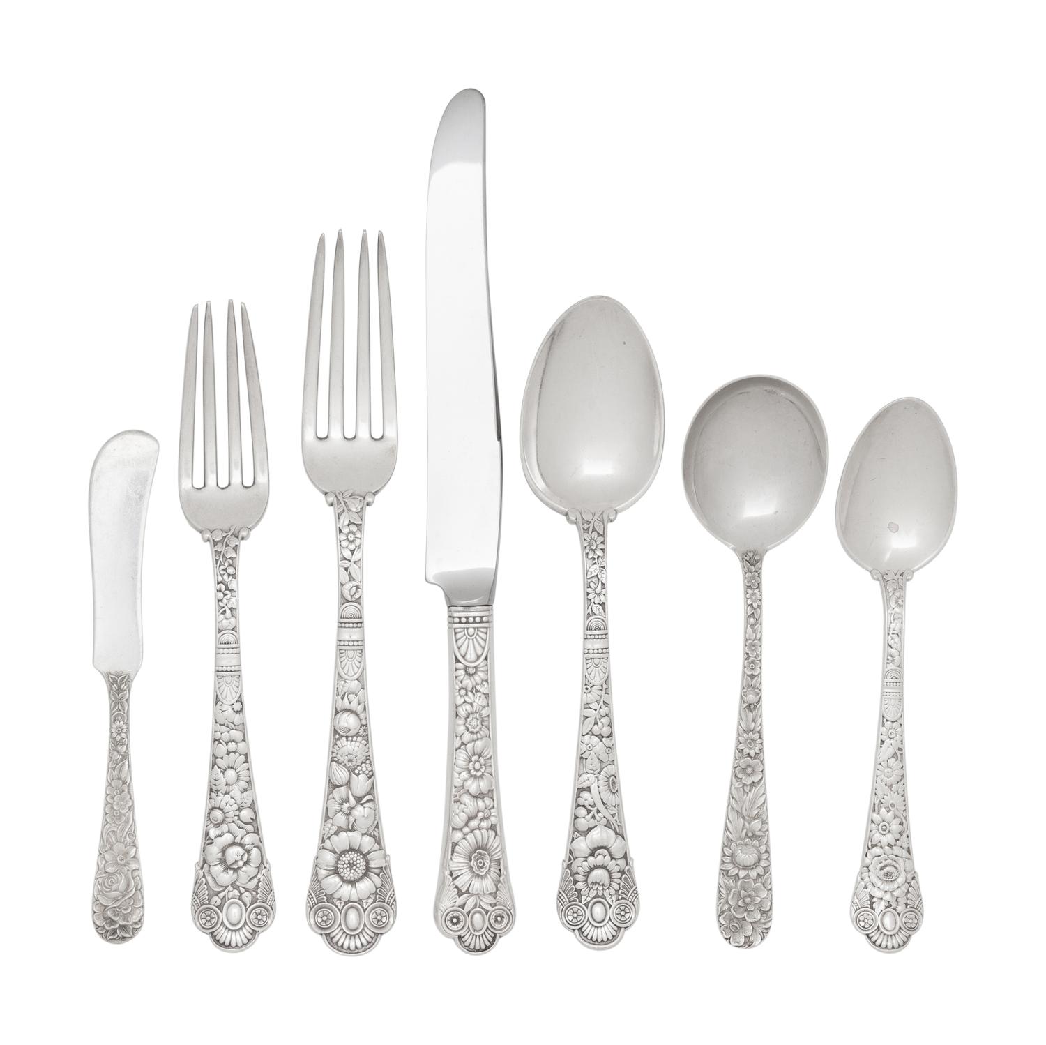 A Gorham Cluny Silver Flatware Service with S. Kirk and Son Repousse Silver Flatware and Serving Articles
