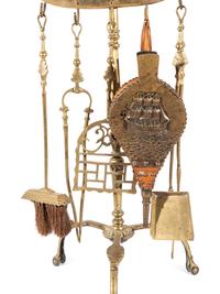 A Brass Nautical Fireplace Tool Set on Stand
