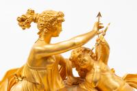 An Empire Gilt and Patinated Bronze Figural Mantel Clock