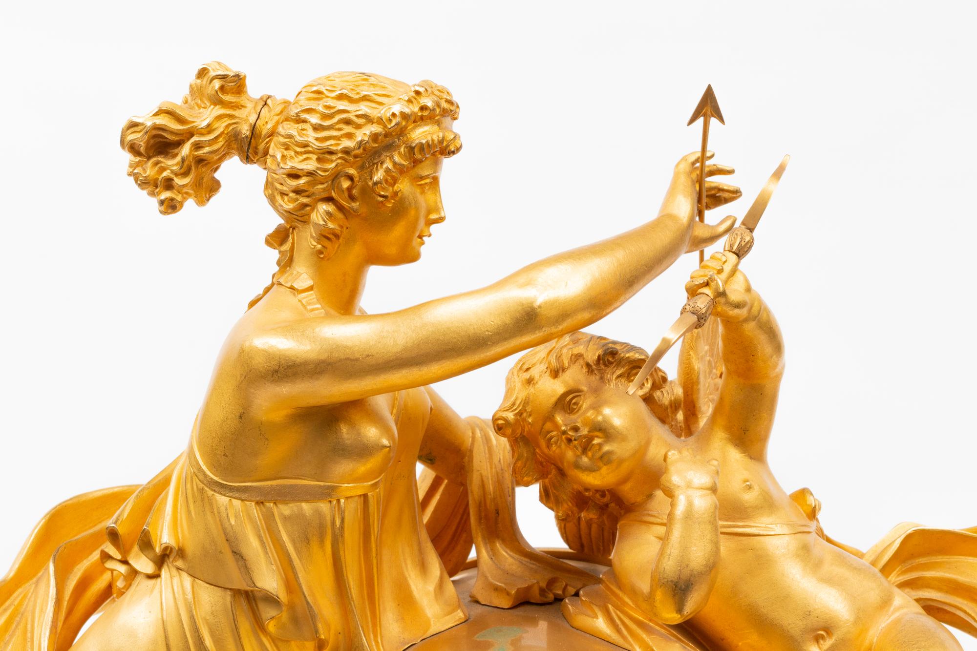 An Empire Gilt and Patinated Bronze Figural Mantel Clock