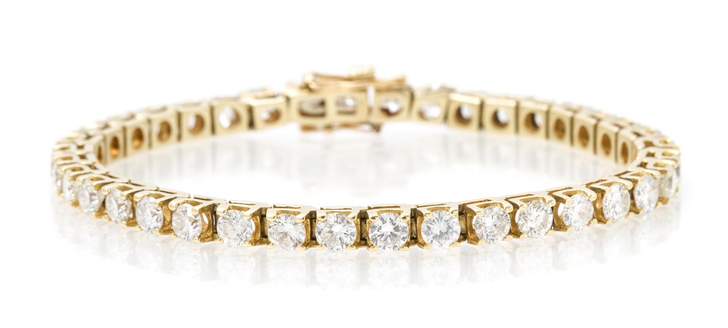 A 14 Karat Yellow Gold and Diamond Line Bracelet, 9.30 dwts.