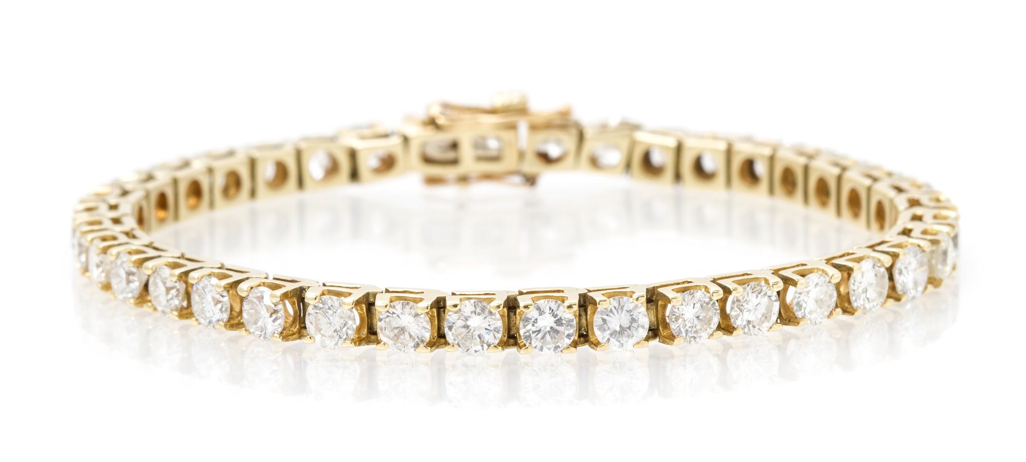A 14 Karat Yellow Gold and Diamond Line Bracelet, 9.30 dwts.