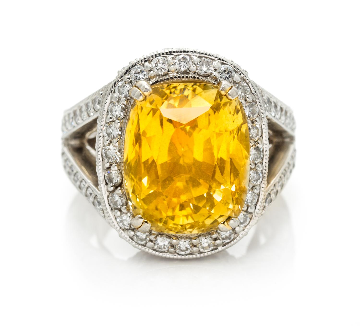 A Platinum, Gold, Yellow Sapphire and Diamond Ring, 15.80 dwts.