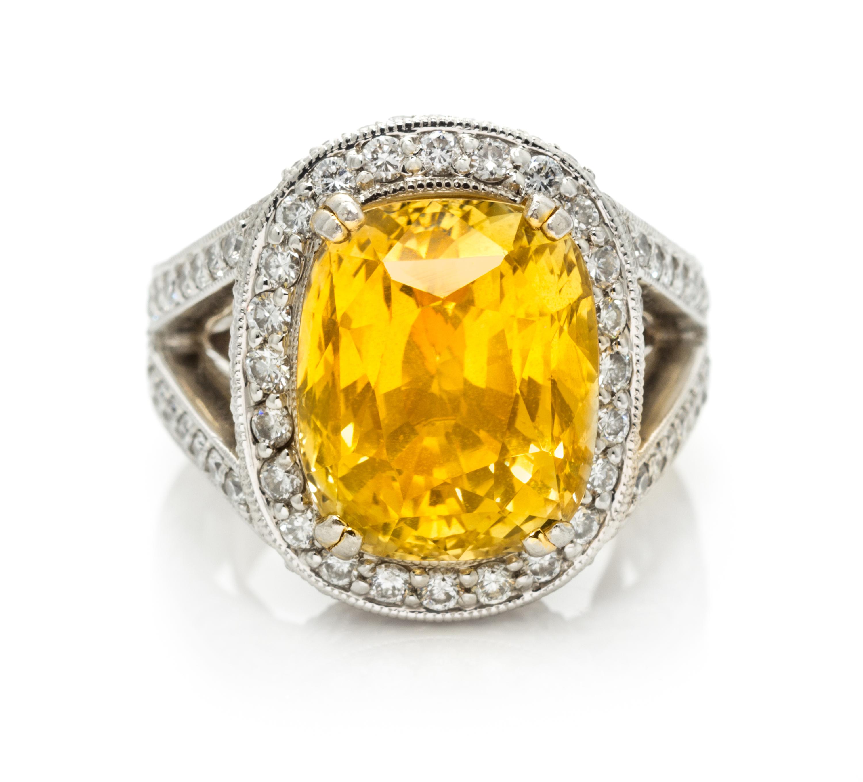 A Platinum, Gold, Yellow Sapphire and Diamond Ring, 15.80 dwts.