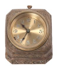 A Tiffany Studios Bronze Desk Clock Height 2 3/4 x width 4 x depth 4 inches.