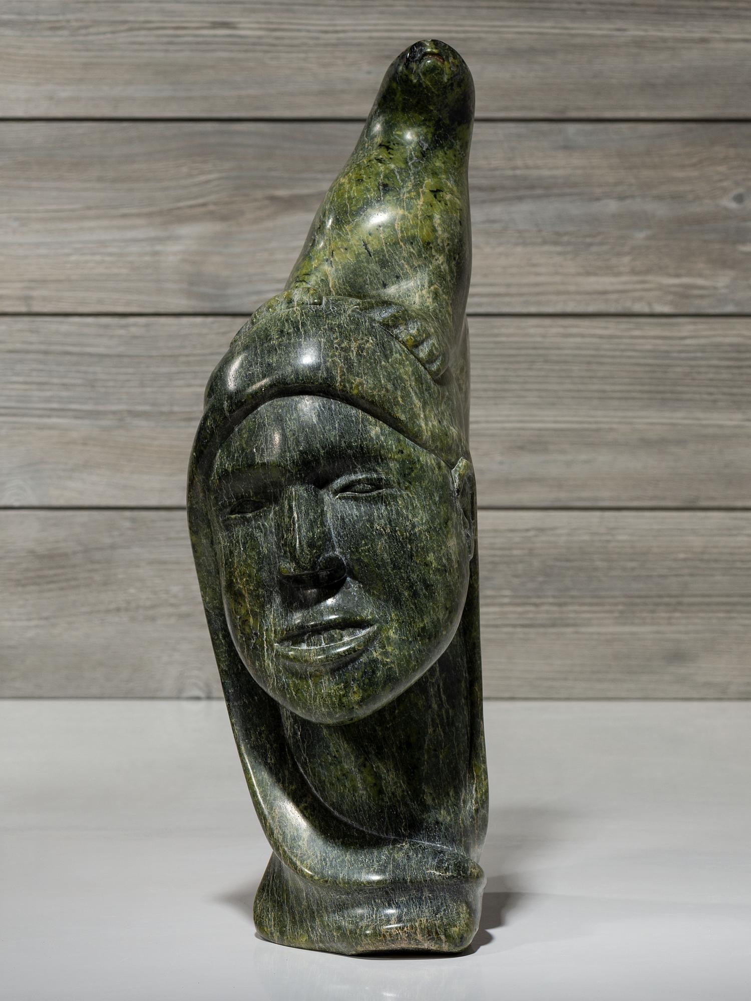 stone sculpture, woman and seal