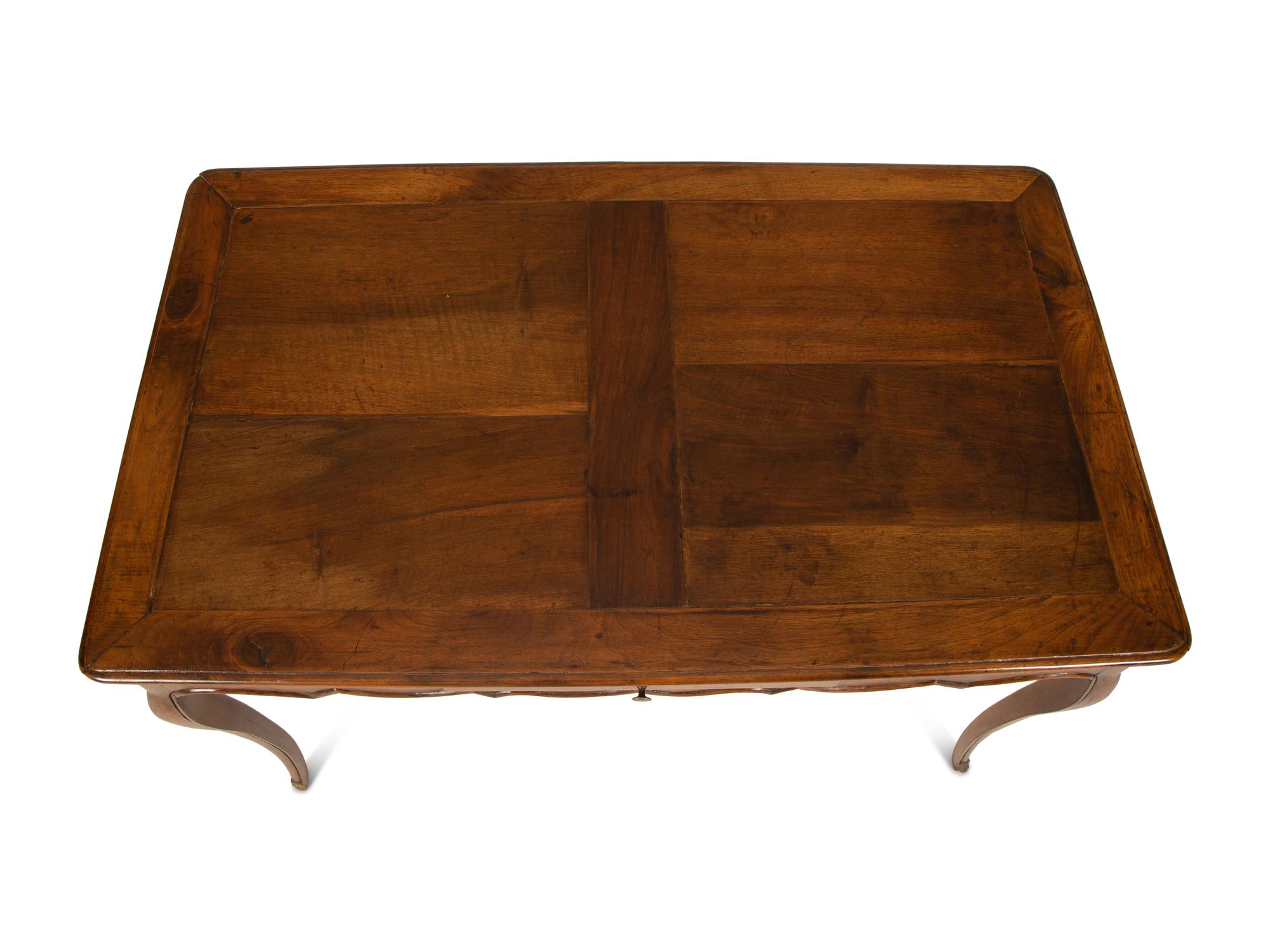A French Provinical Carved Walnut Writing Table