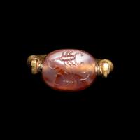 A Phoenician or Cypriot Gold and Carnelian Swivel Ring with Two Scorpions