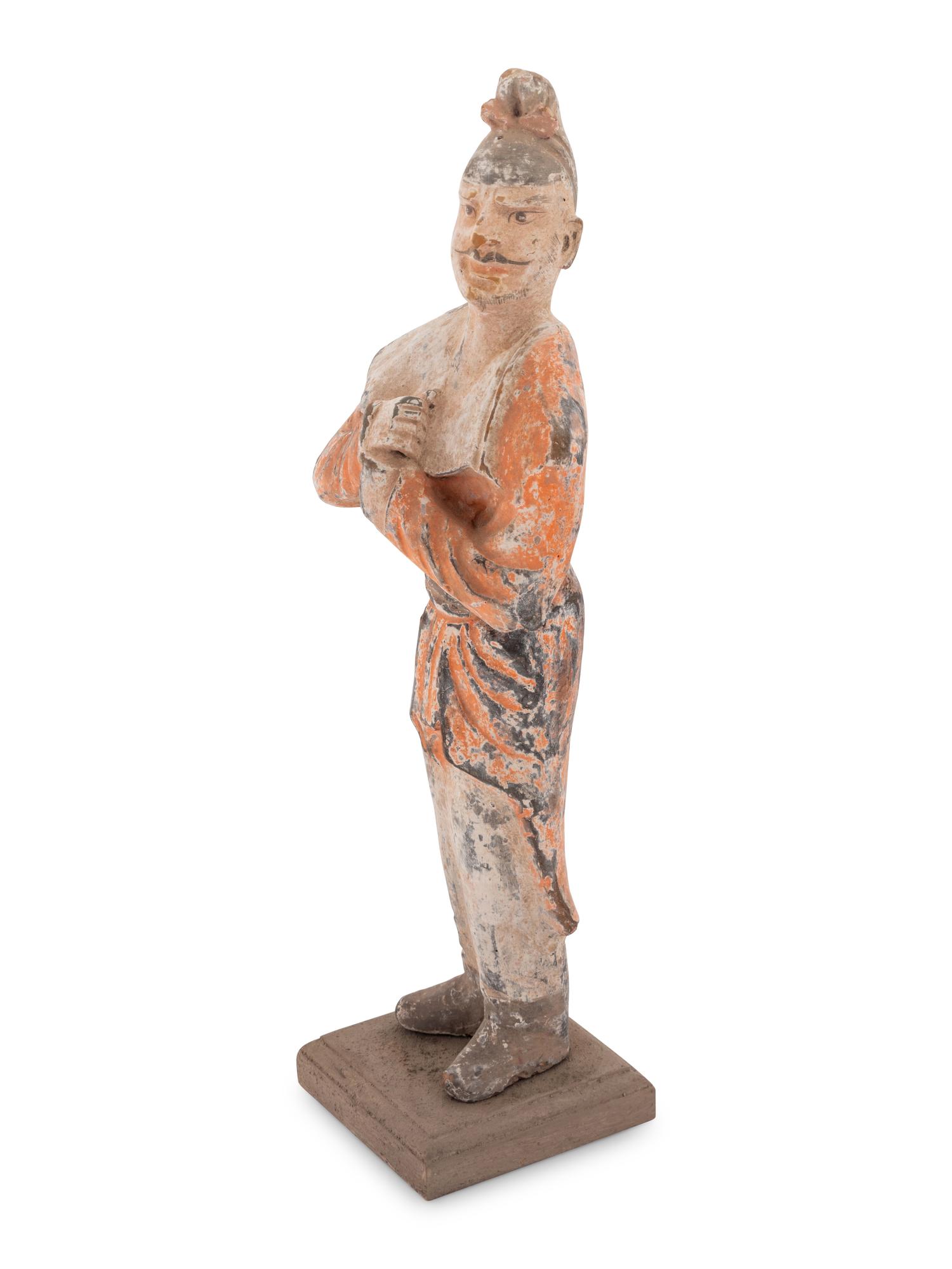 A Chinese Painted Pottery Figure of a Foreign Groom