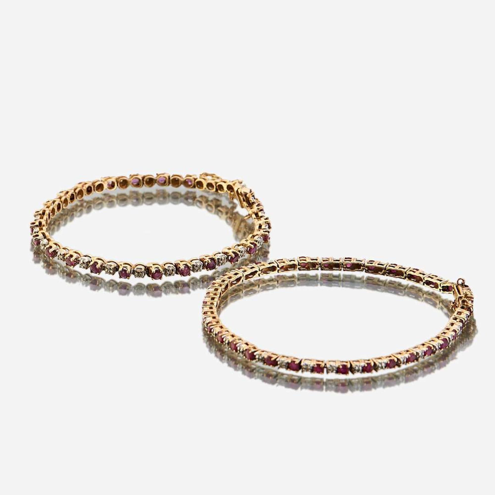 A pair of ruby, diamond, and gold bracelets