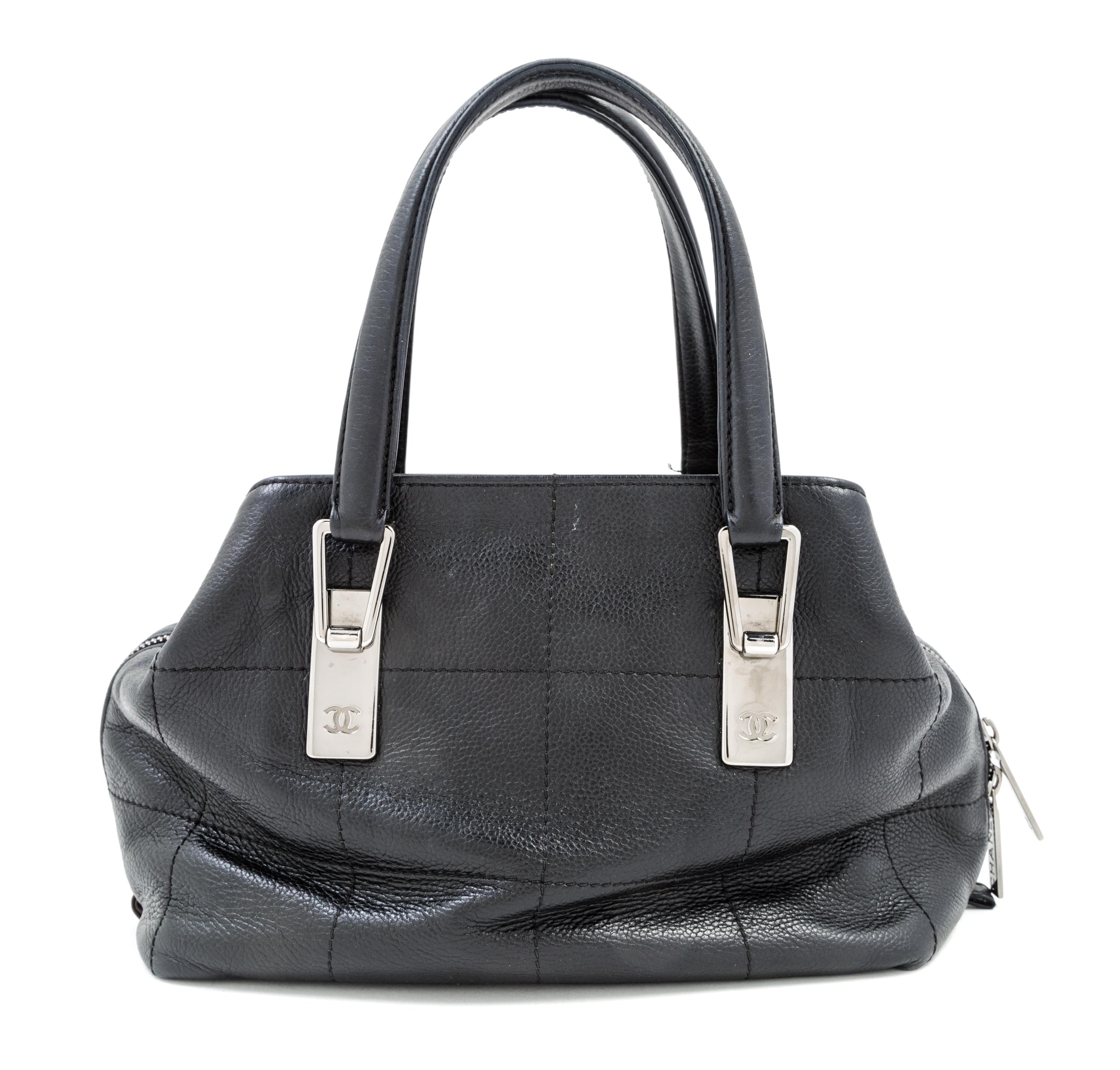 A Chanel Black Leather Handbag, 9.5" x 7" 5"; Handle drop: 5.5".