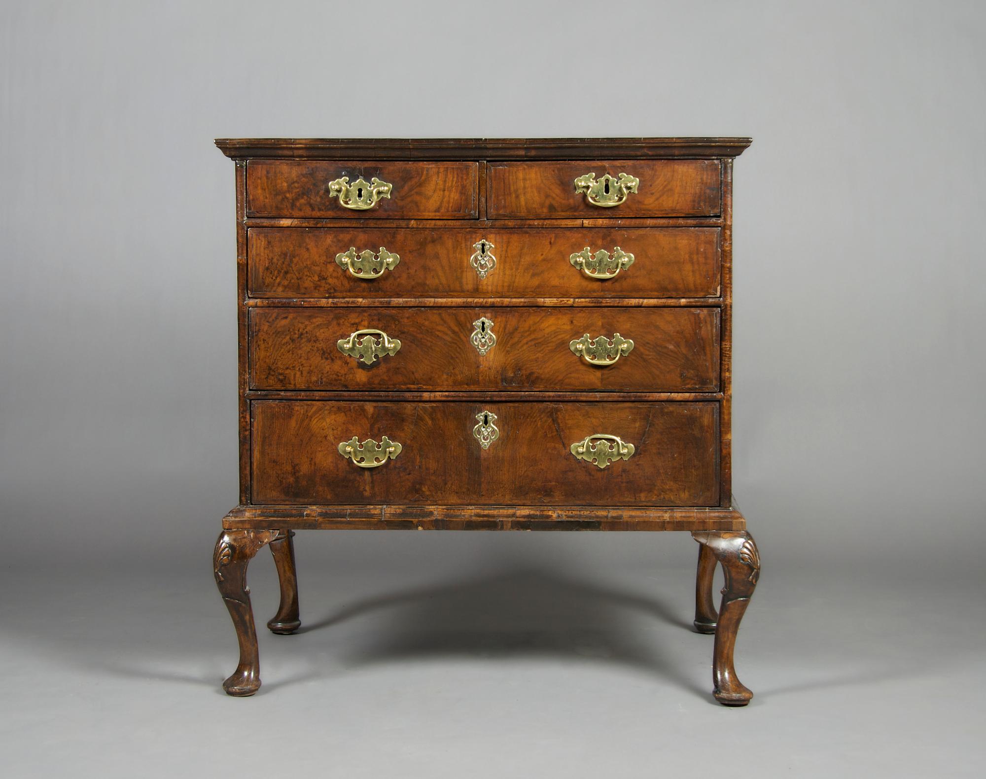 A Queen Anne Style Walnut Chest of Drawers, Height 39 1/2 x width 37 x depth 23 inches.