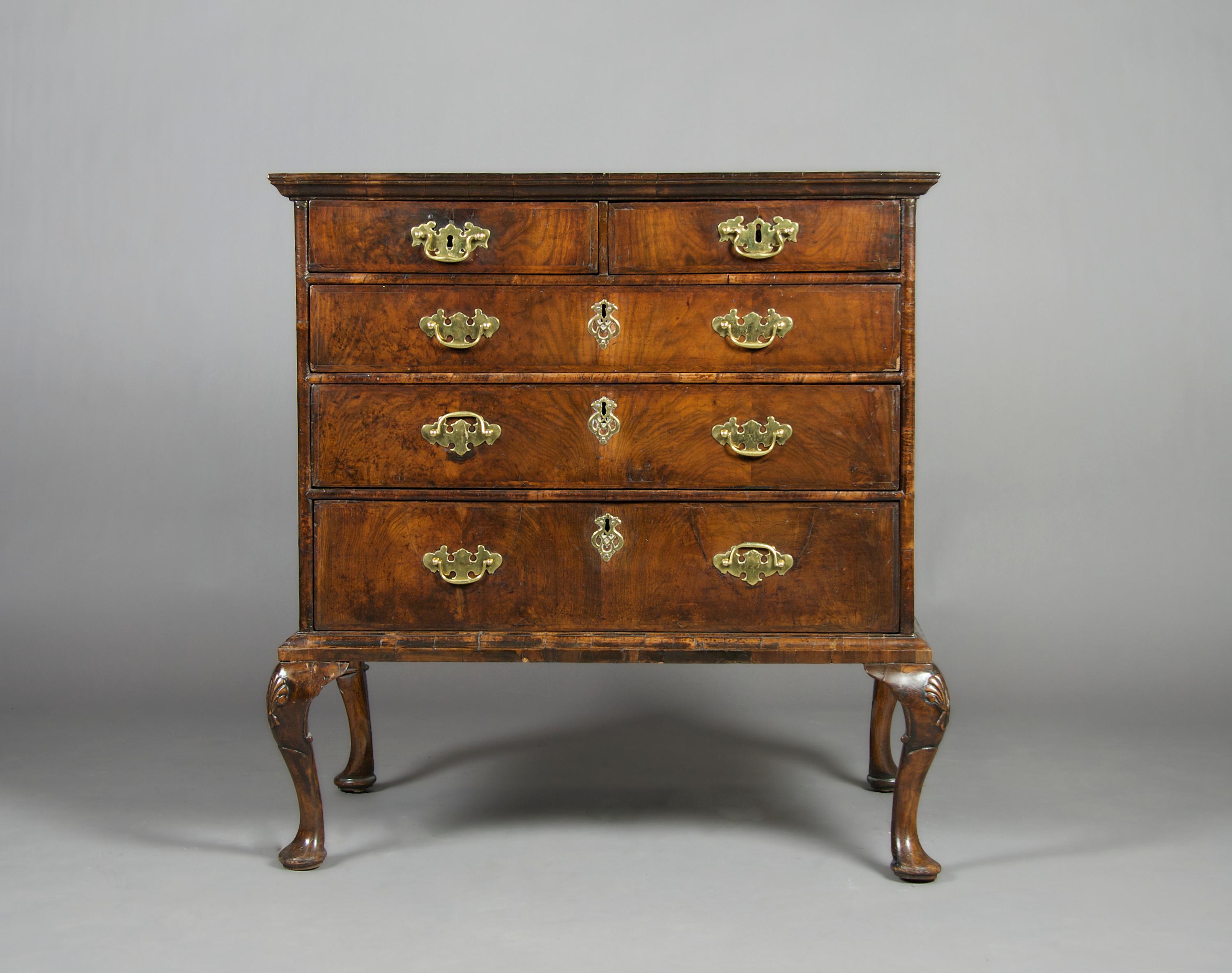 A Queen Anne Style Walnut Chest of Drawers, Height 39 1/2 x width 37 x depth 23 inches.