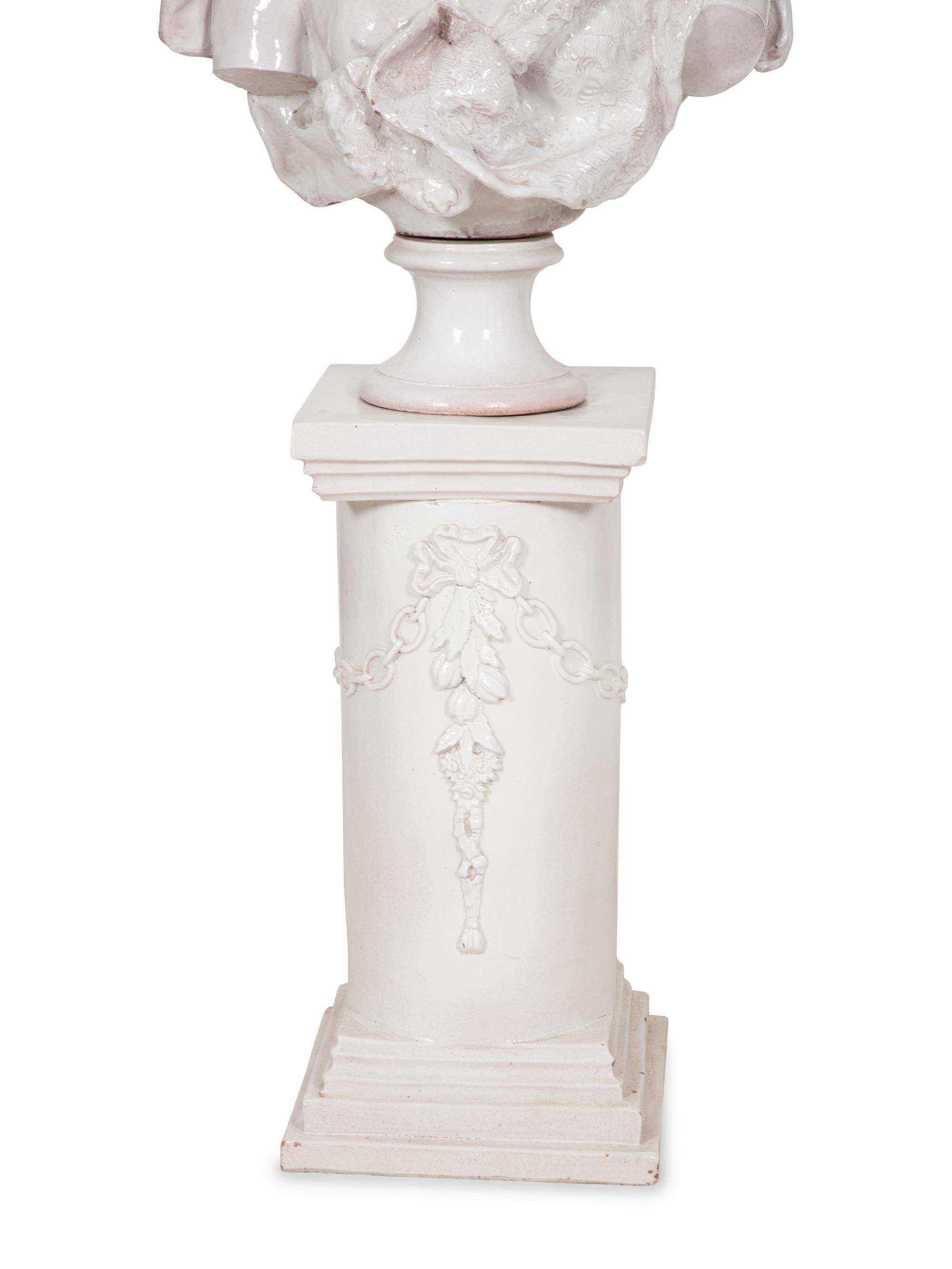 A Pair of Italian Glazed Terracotta Portrait Busts on Neoclassical Style Pedestals