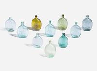 A collection of ten mold-blown colored glass bottles, various makers, 19th century