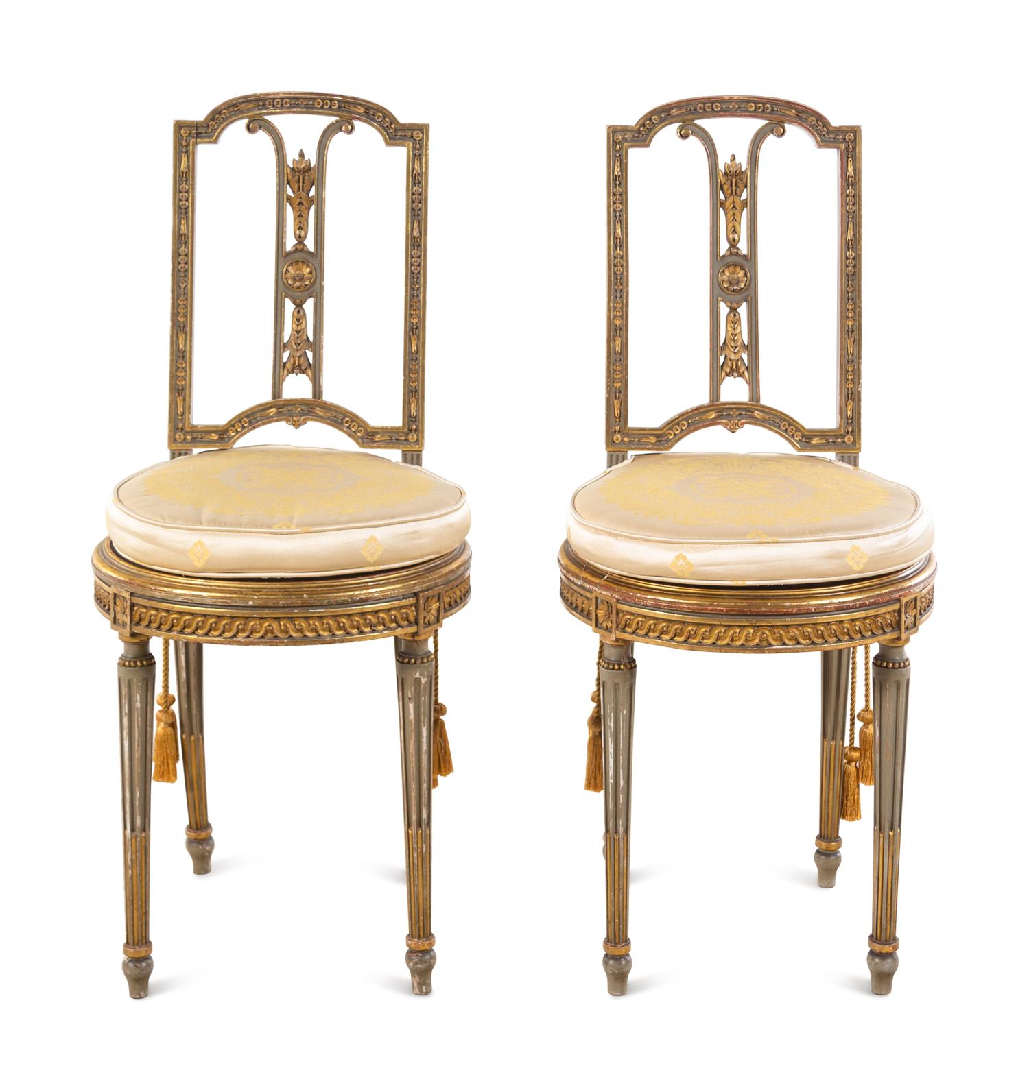 A Pair of Louis XVI Style Painted and Parcel Gilt Side Chairs