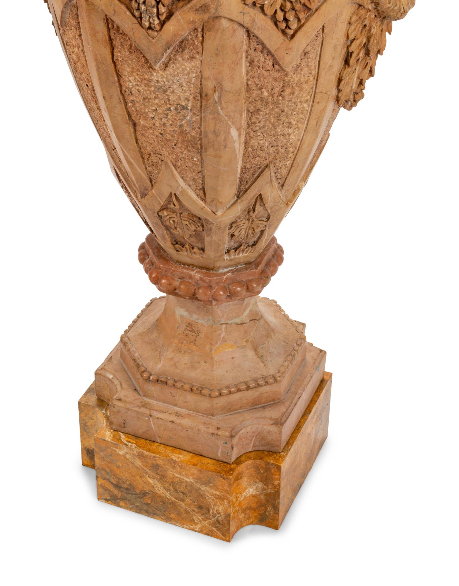 A Pair of Gothic Style Marble Urns with Satyr Handles