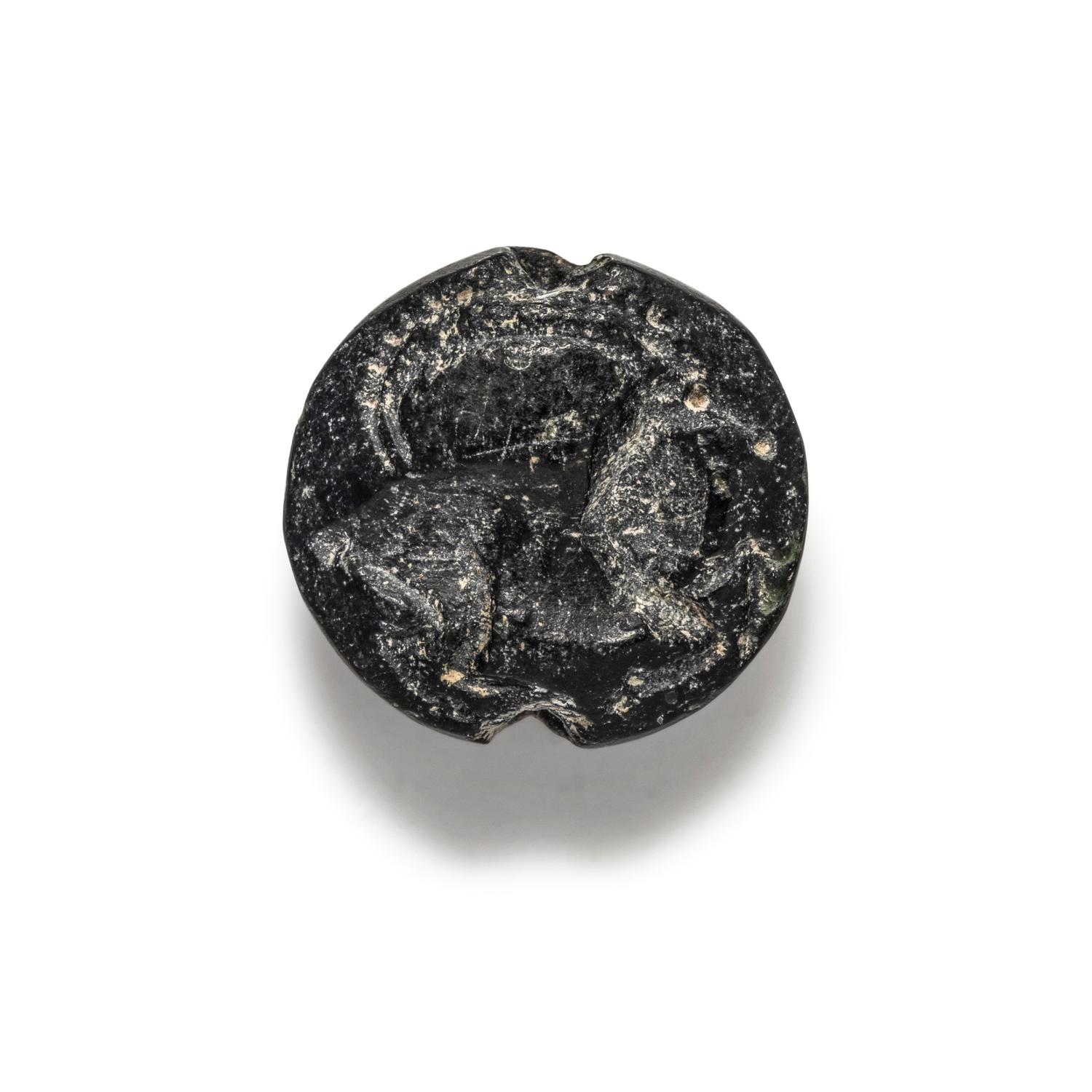 A Minoan Black Steatite Lentoid with a Goat