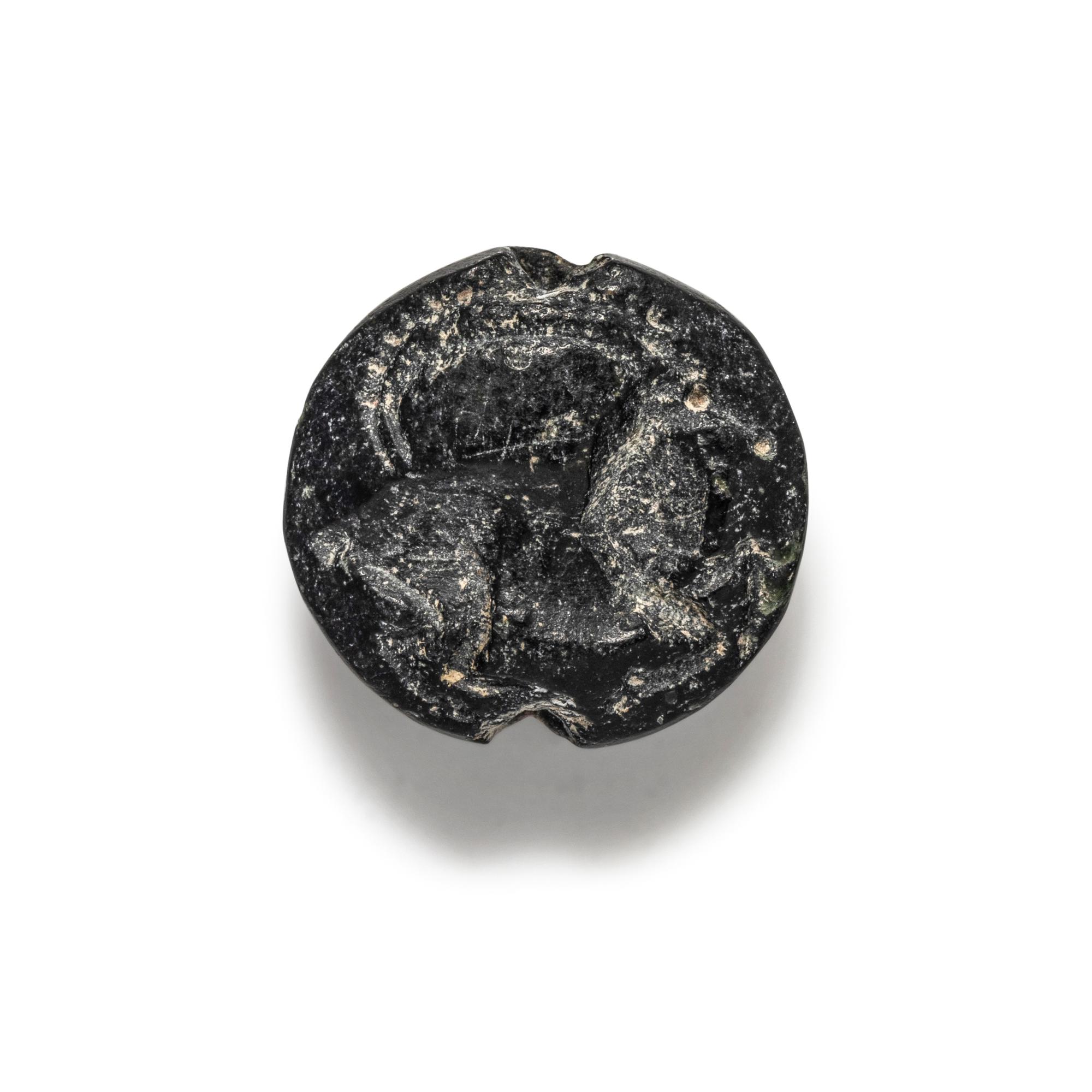 A Minoan Black Steatite Lentoid with a Goat