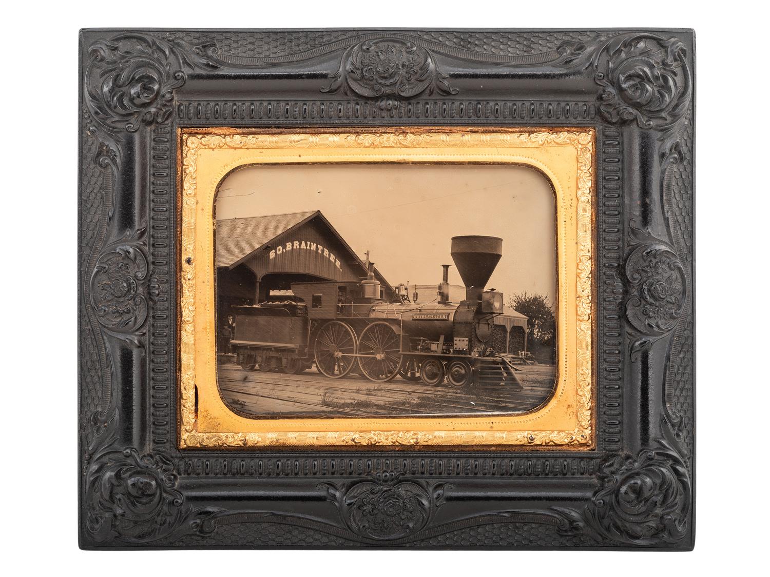 [EARLY PHOTOGRAPHY]. Quarter plate ambrotype of a train engine and tender at the South Braintree, Massachusetts, train station.