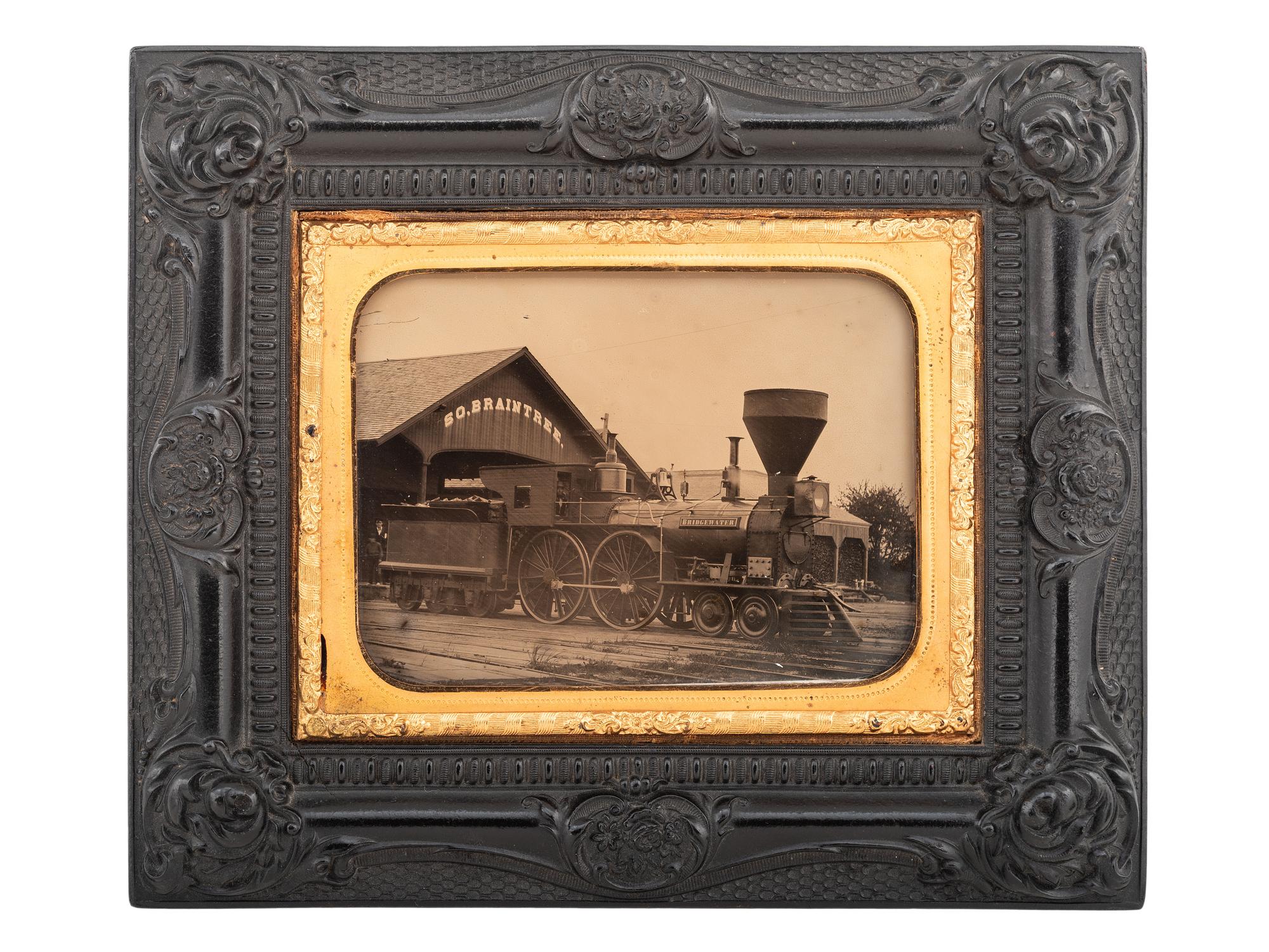 [EARLY PHOTOGRAPHY]. Quarter plate ambrotype of a train engine and tender at the South Braintree, Massachusetts, train station.
