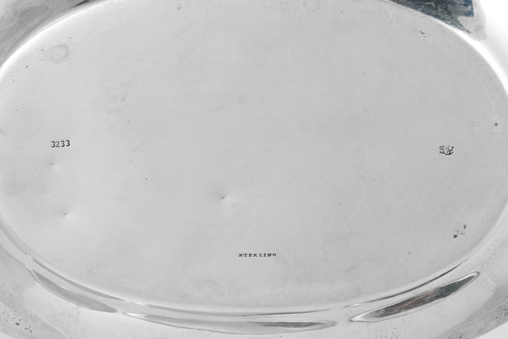 A Group of Four American Silver Platters