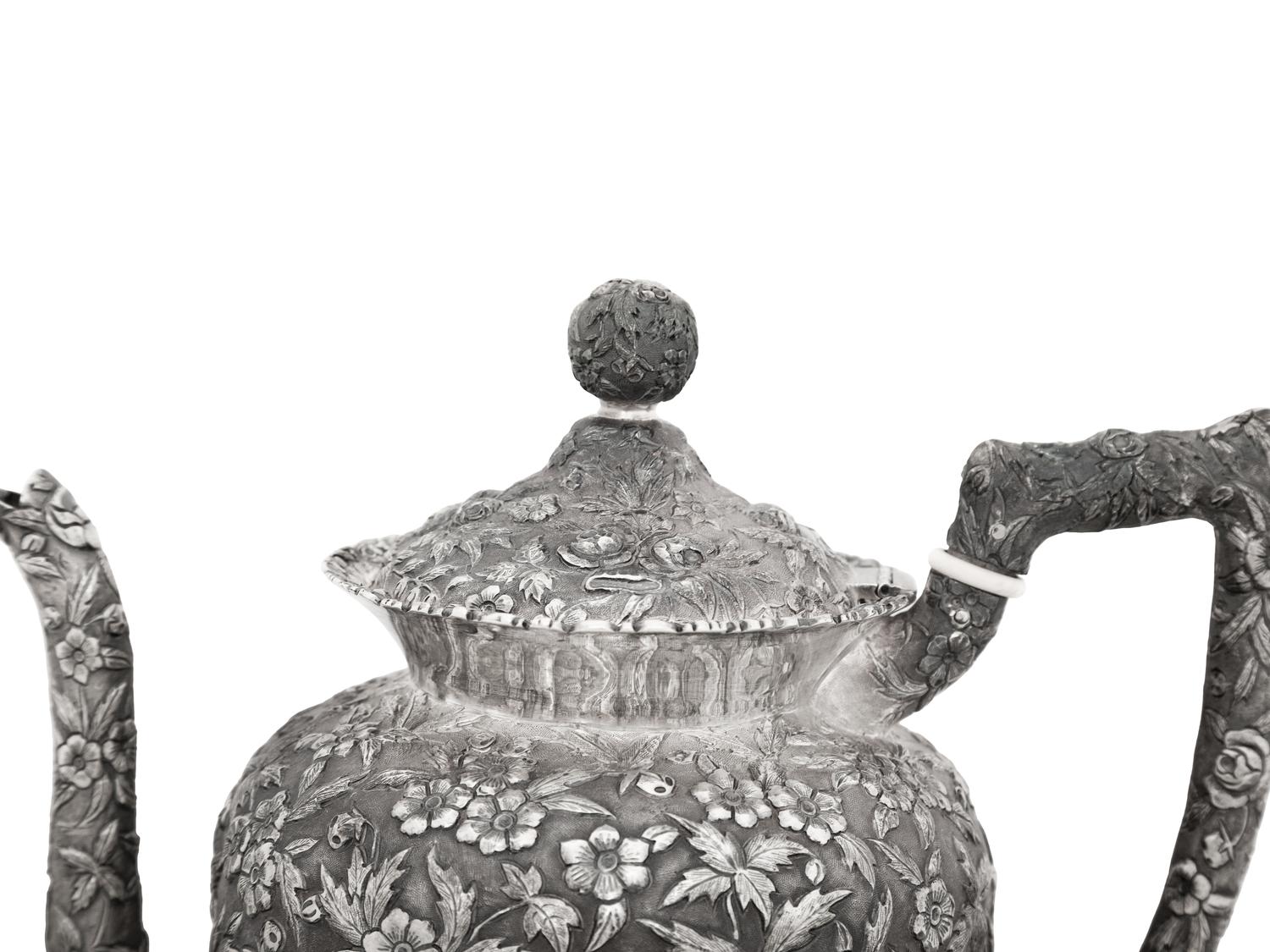An American Silver Repoussé Three-Piece Coffee Service