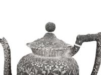 An American Silver Repoussé Three-Piece Coffee Service