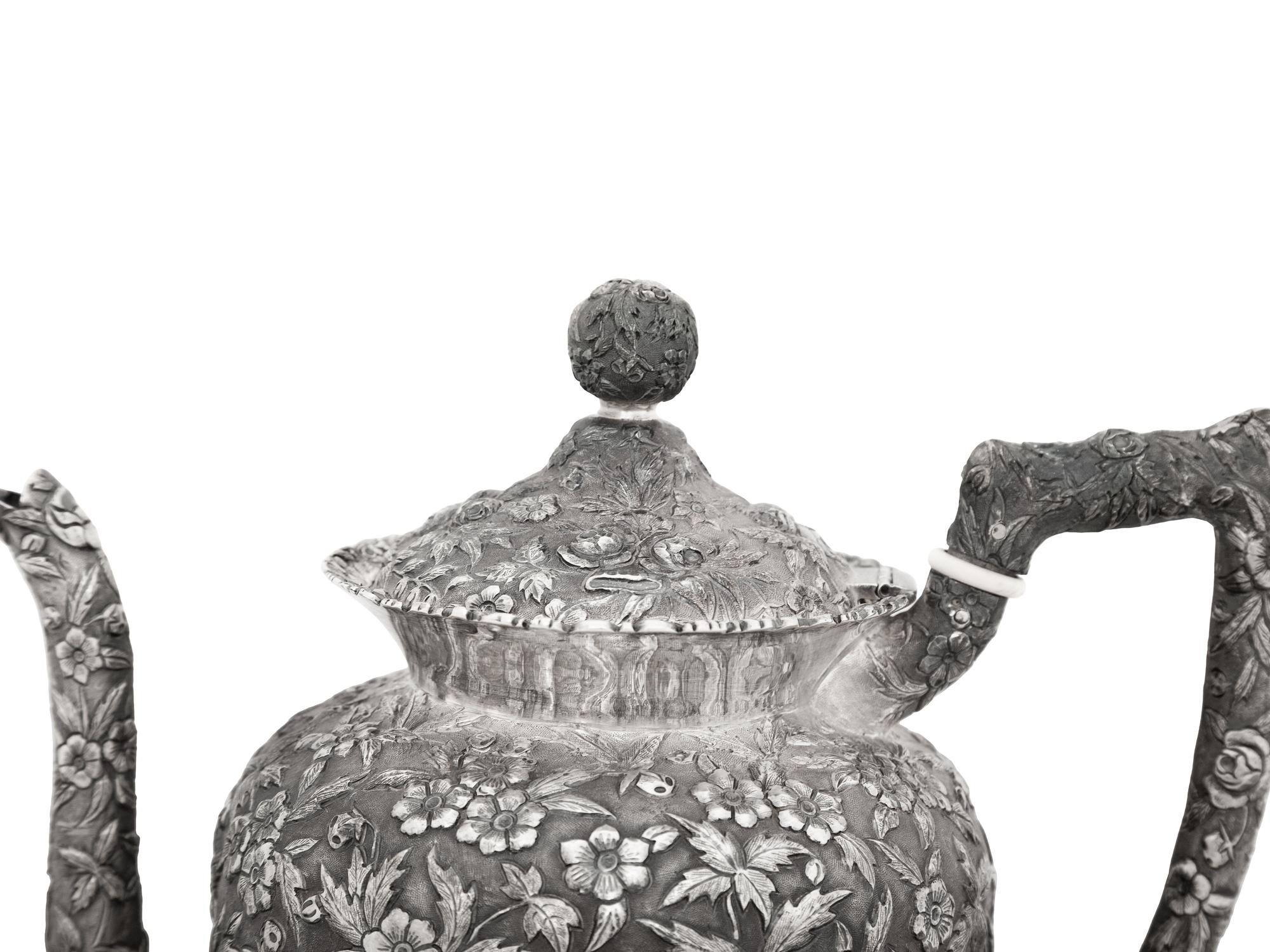 An American Silver Repoussé Three-Piece Coffee Service