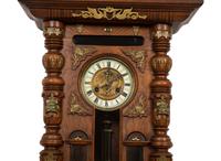 An Austrian Carved Oak Regulator Clock