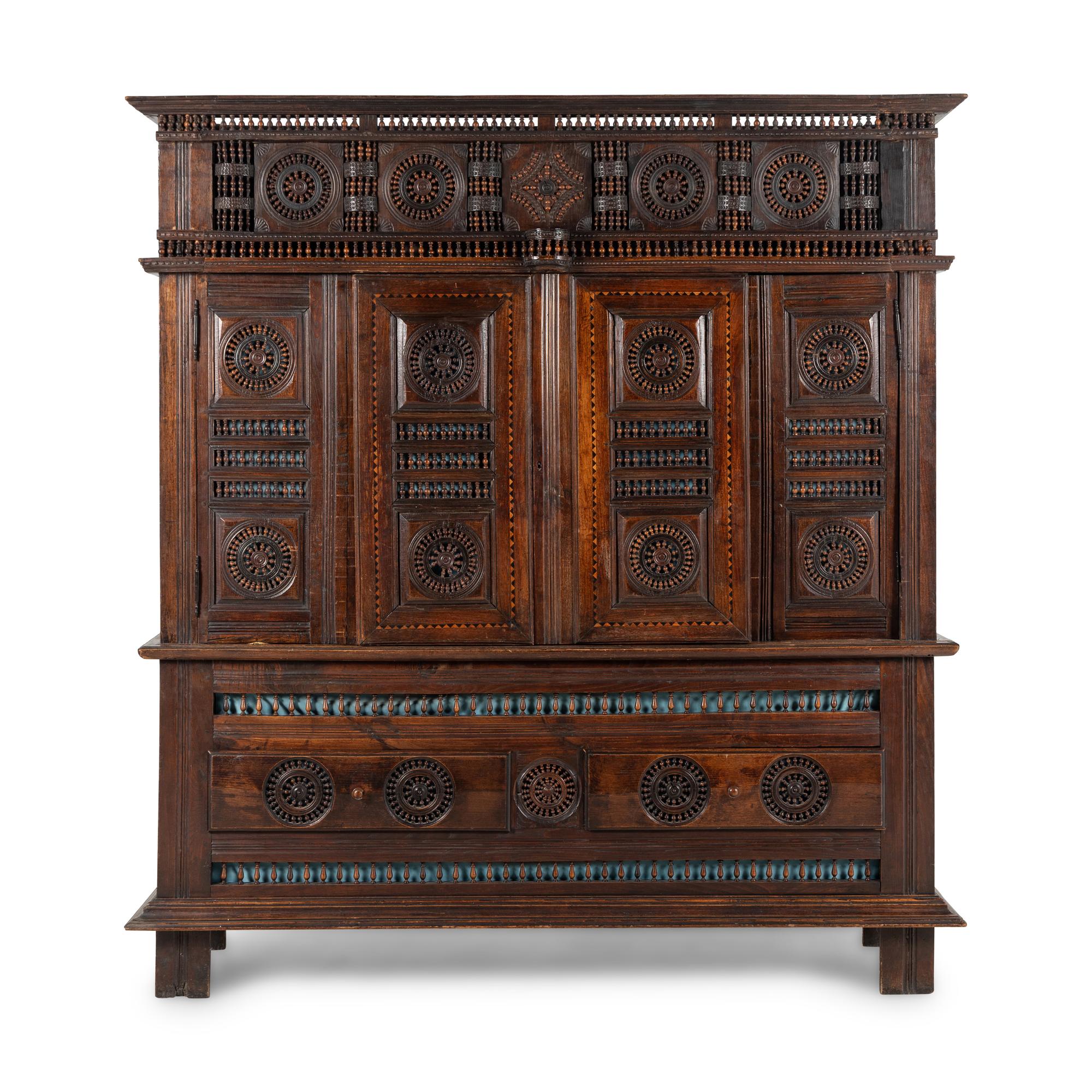 A Breton Carved Walnut Cabinet