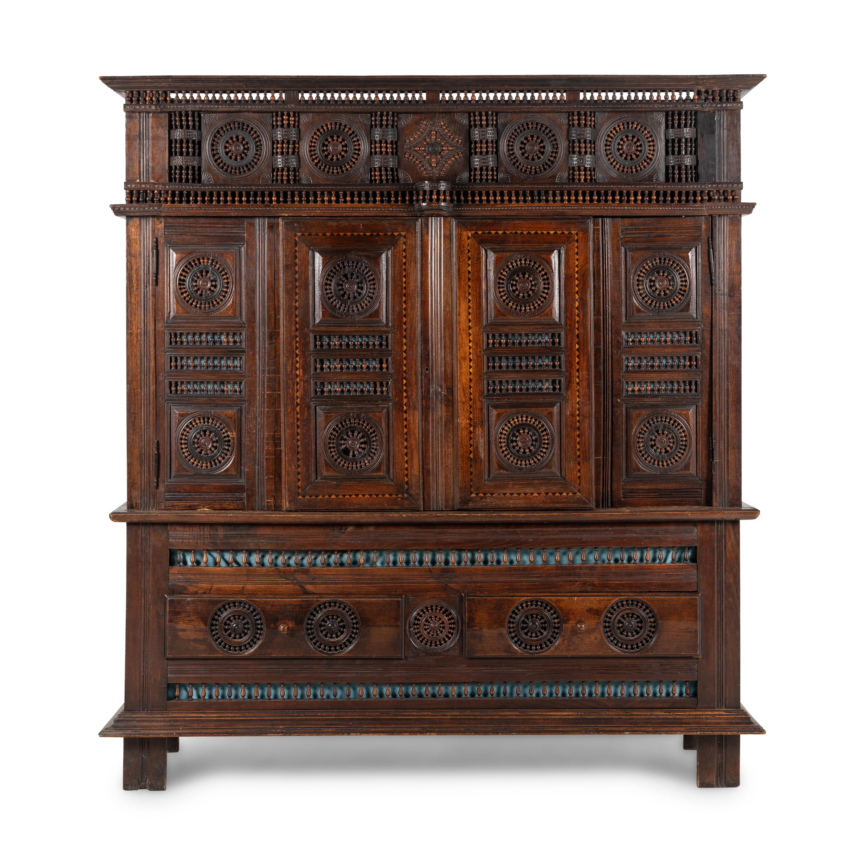 A Breton Carved Walnut Cabinet
