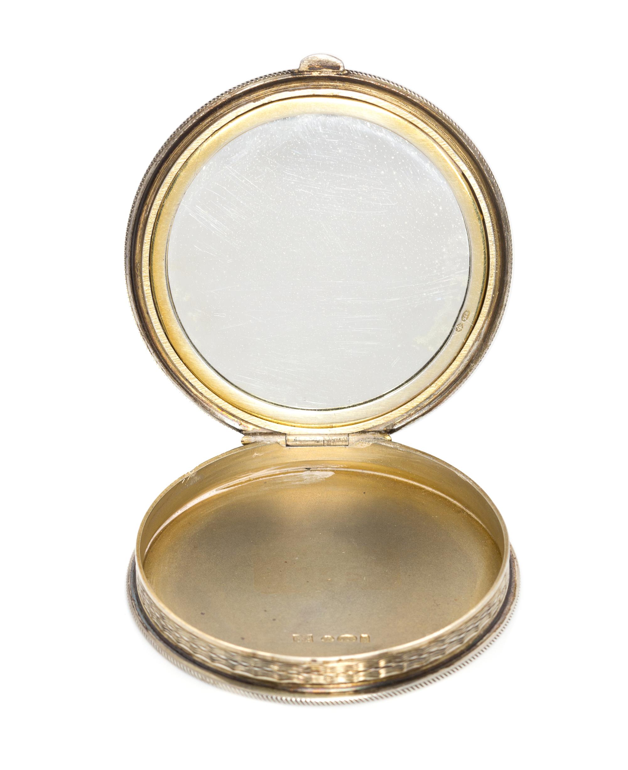 A Continental Silver and Enamel Compact, Import Mark GS, London, 1925, the lid enameled with bamboo shoots, dragonflies and four Chines