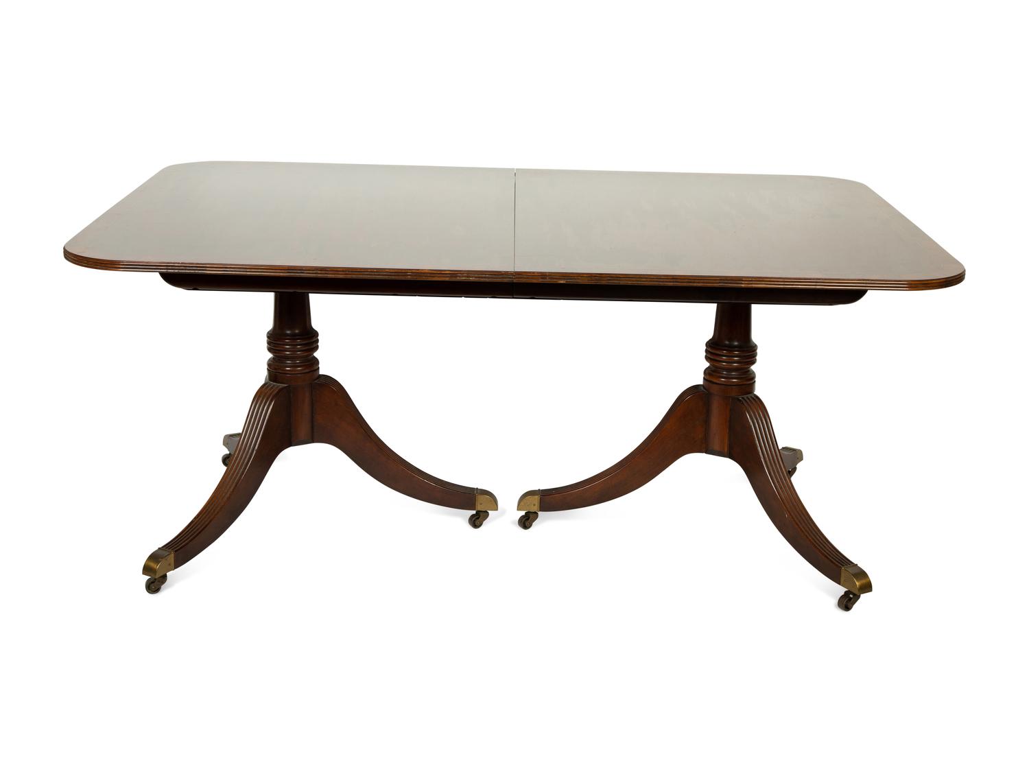 A Baker George III Style Mahogany Double-Pedestal Dining Table