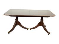 A Baker George III Style Mahogany Double-Pedestal Dining Table