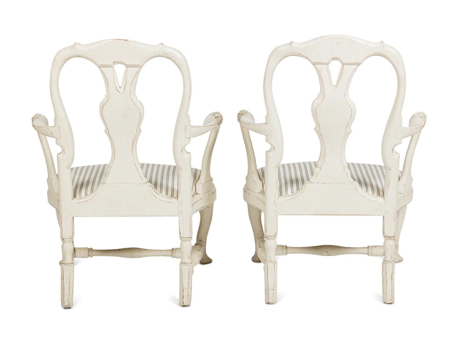 A Pair of Swedish White-Painted and Parcel-Gilt Open Armchairs