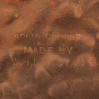 An Arts & Crafts Hammered Copper Plate