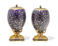 A Pair of Wedgwood Parcel Gilt Porcelain Covered Urns