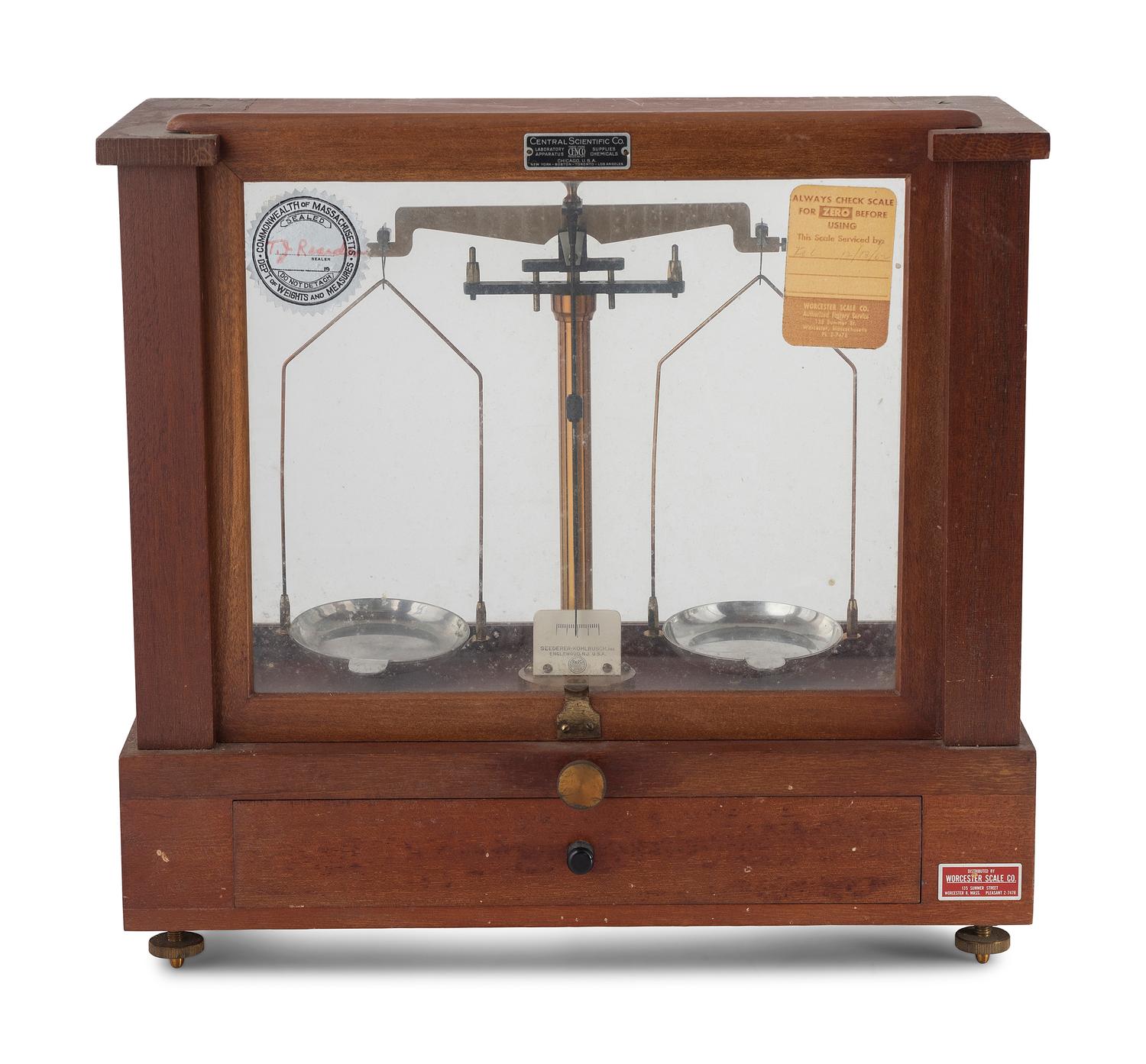 A Central Scientific Co. Scale, an Ingraham Eight-Day Movement Mantle Clock and Framed Salesmen Samples of Blue Grass Axes