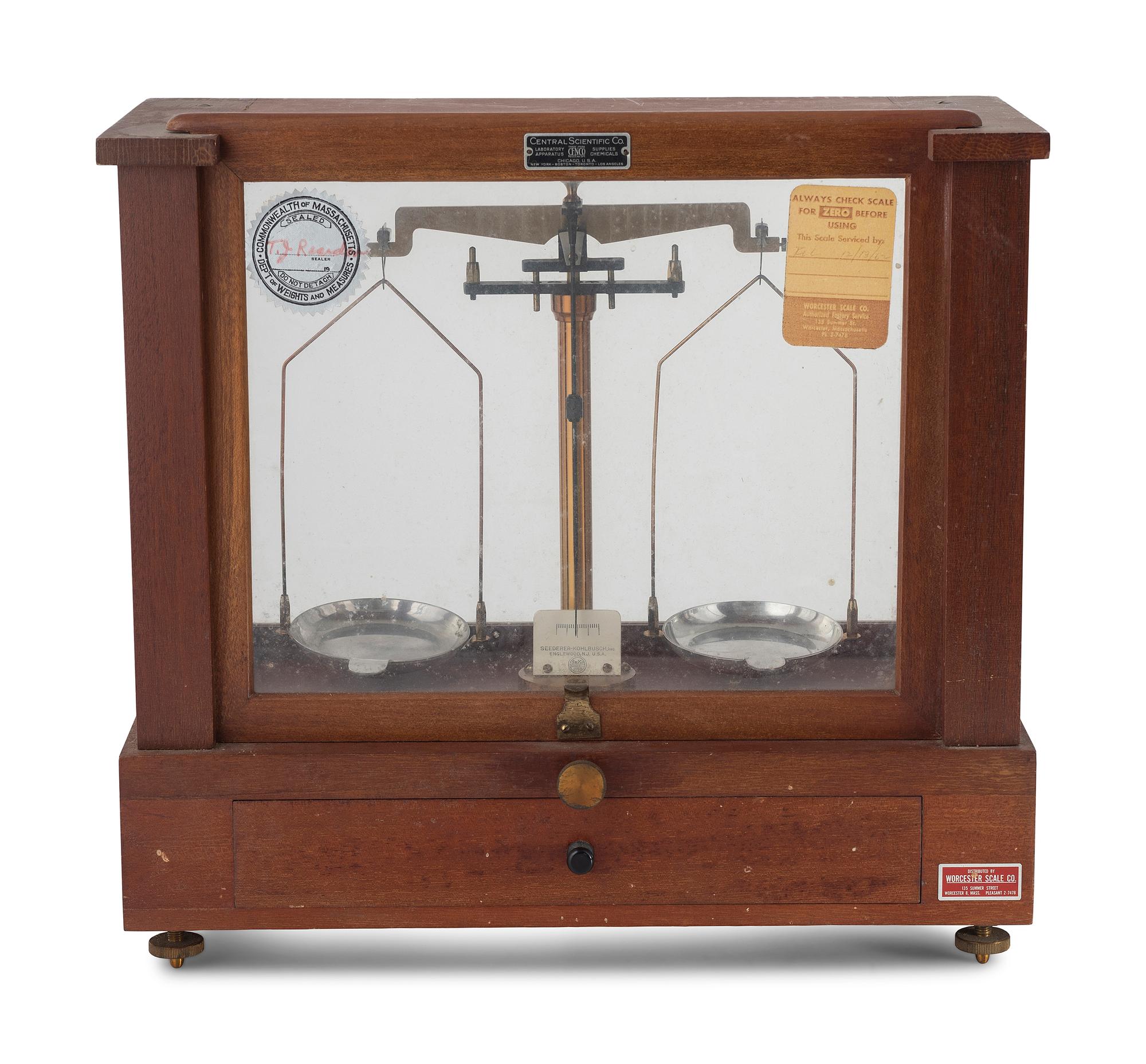A Central Scientific Co. Scale, an Ingraham Eight-Day Movement Mantle Clock and Framed Salesmen Samples of Blue Grass Axes
