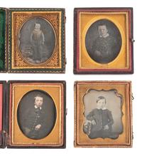 [EARLY PHOTOGRAPHY]. 14 sixth plate daguerreotypes of rather serious male children.