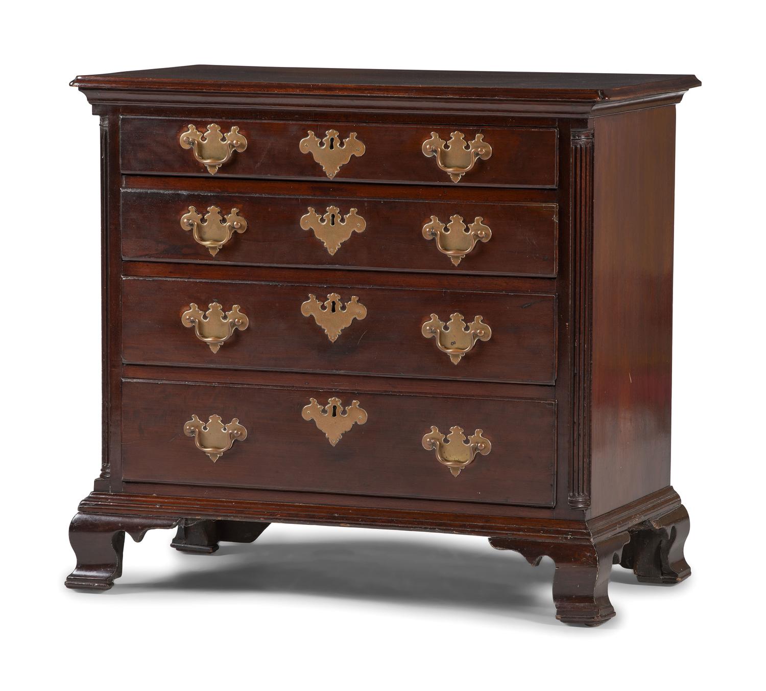 A Chippendale Carved and Figured Mahogany Chest of Drawers
