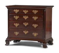 A Chippendale Carved and Figured Mahogany Chest of Drawers