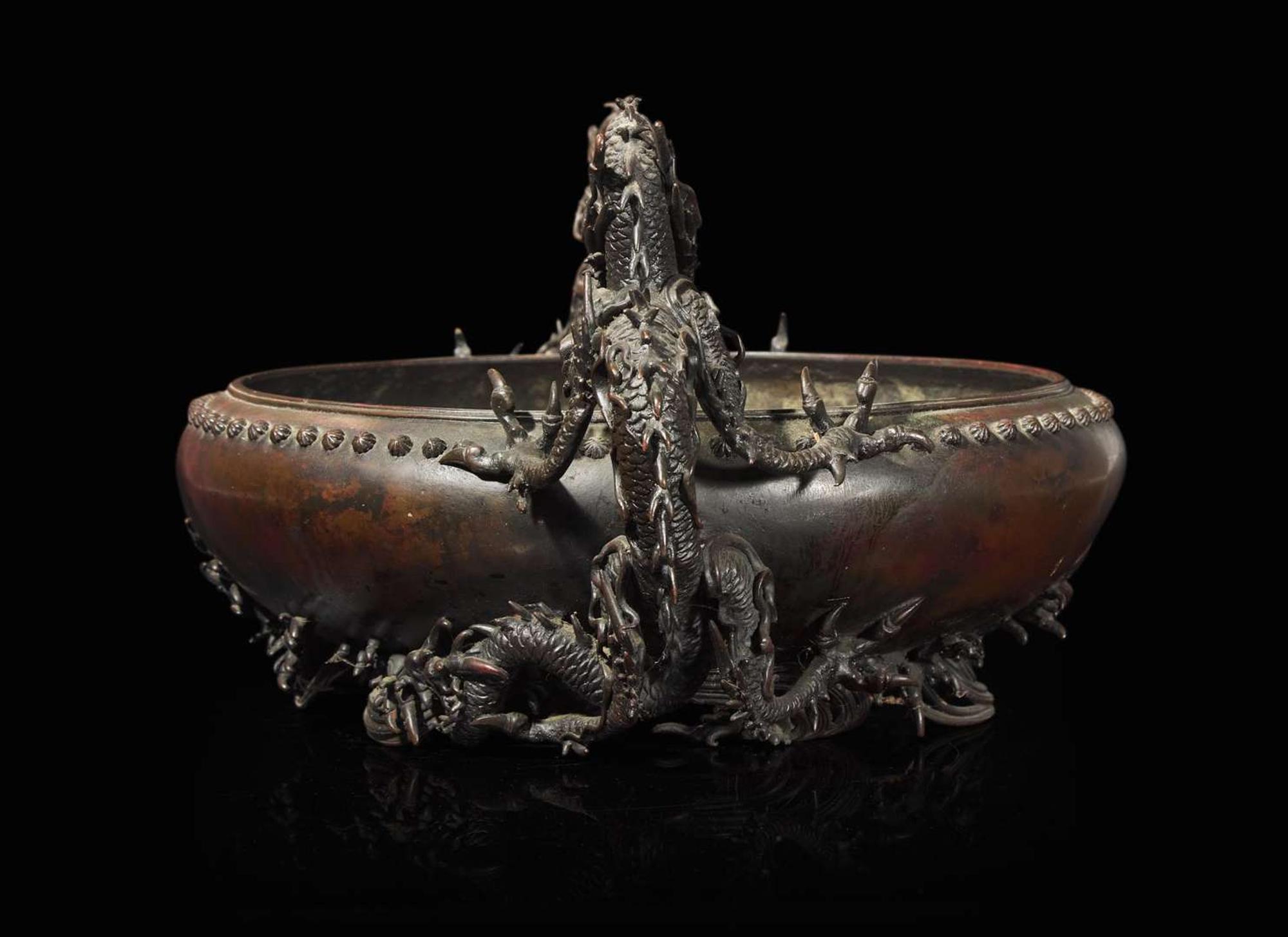 A Japanese patinated bronze "Dragons" jardinière, Meiji period 日本龍紋銅盤 明治