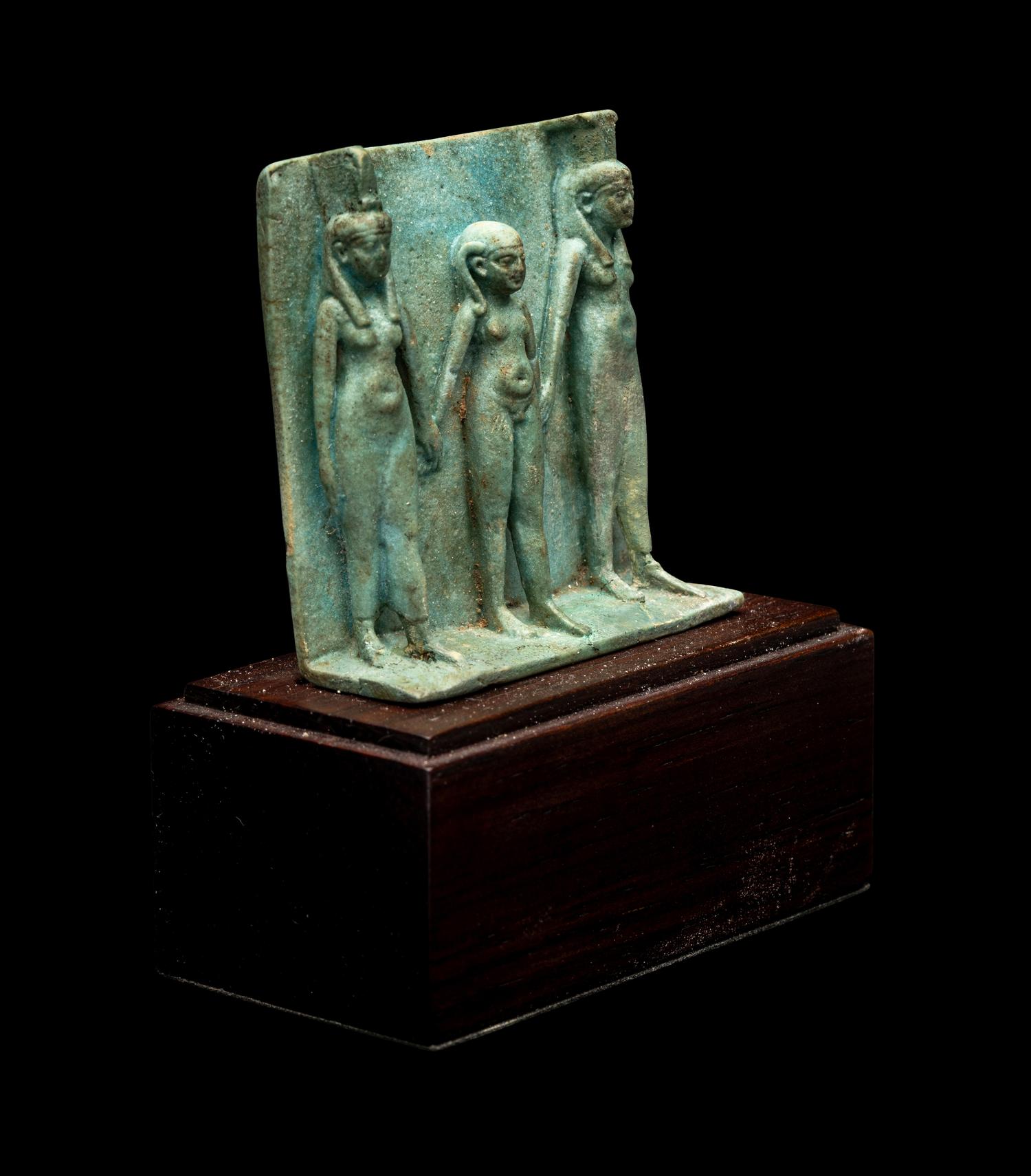 An Egyptian Faience Triad Amulet